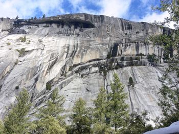 Low angle view of rock formation against sky