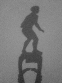 Shadow of man on wall