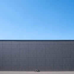 Low angle view of building against clear blue sky