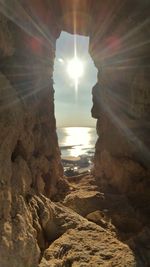 Sun shining through rocks