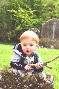 Portrait of cute boy exploring old ruins