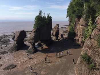 High angle view of rocks on beach against sky