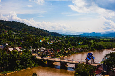 High angle view of trees and buildings against sky