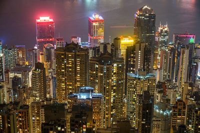 Aerial view of city lit up at night