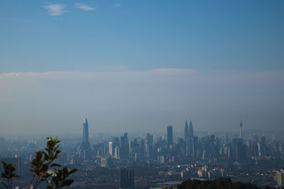 Modern buildings in city against sky