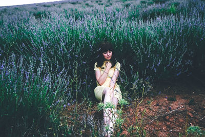 Portrait of beautiful woman on field