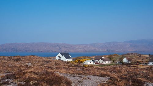 Scenic view of landscape against clear blue sky