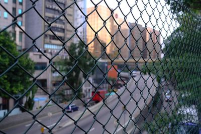 City seen through chainlink fence