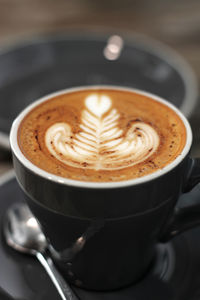 Close-up of cappuccino on table