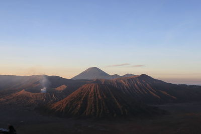 Scenic view of mountains against sky during sunset