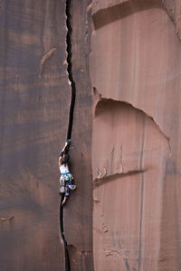 Low angle view of man on rock formation