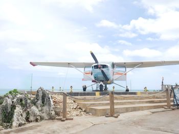 Low angle view of airplane against sky