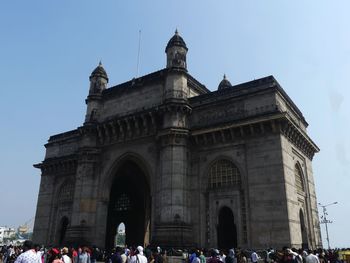 Group of people in front of historical building