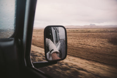 Reflection of car on side-view mirror