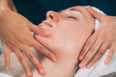 Close-up of woman getting massage therapy at spa