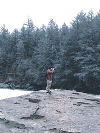 Full length of person standing on snow covered land