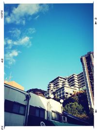 Low angle view of building against blue sky