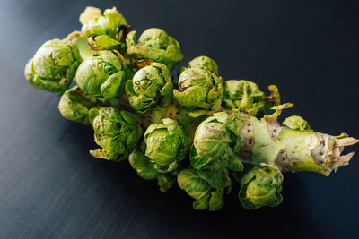 Close-up of fresh vegetables on table against black background
