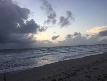 Scenic view of beach against sky during sunset