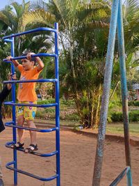 Full length of girl playing in playground