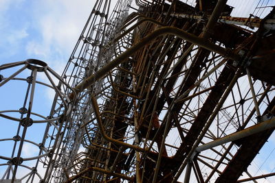 Low angle view of ferris wheel against sky