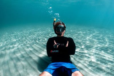 Portrait of man swimming in sea