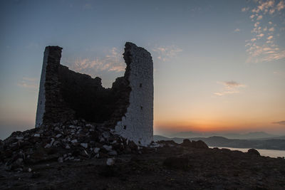 Rock formations against sky during sunset