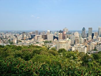 Panoramic view of buildings in city against sky