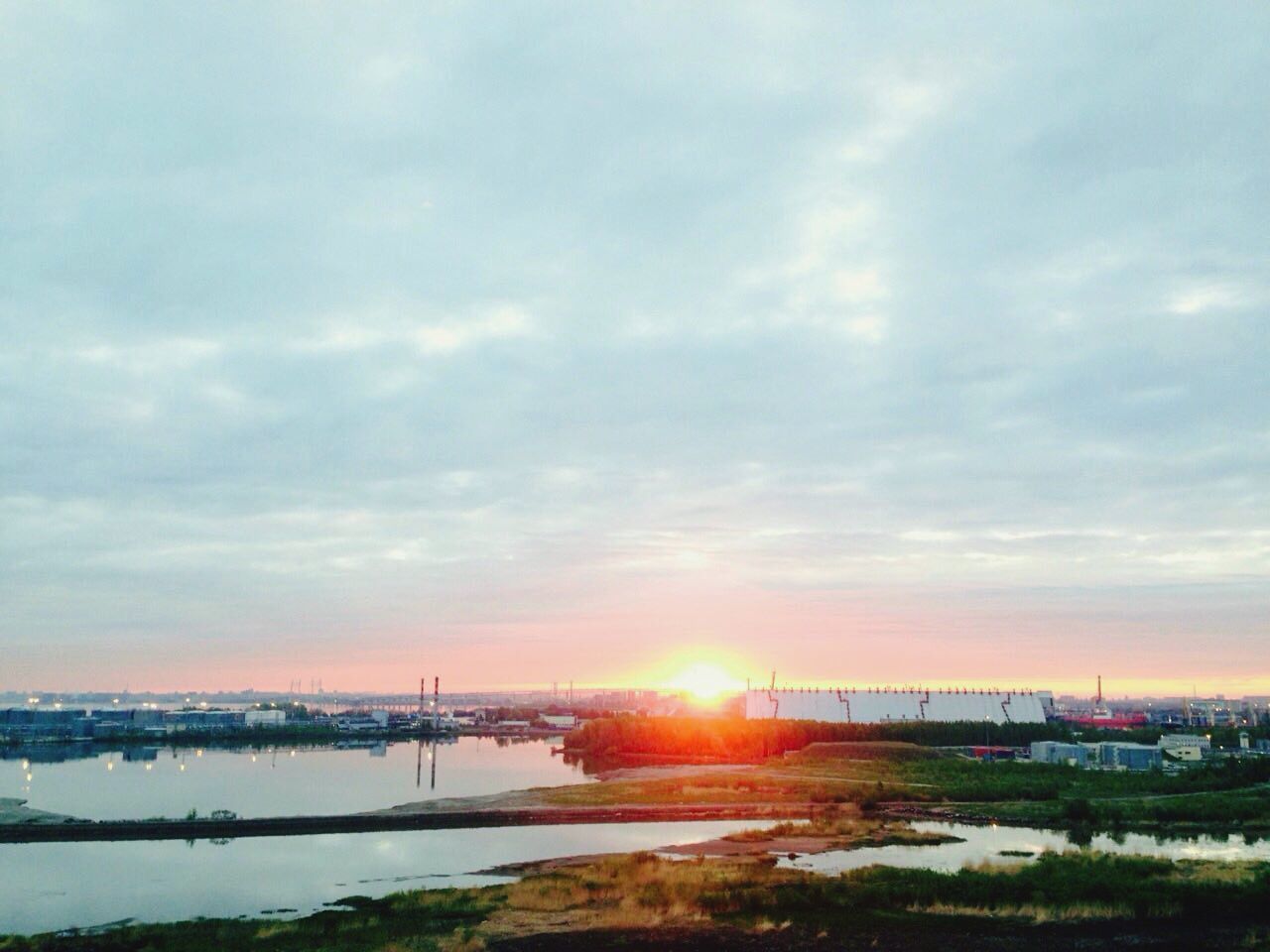 SCENIC VIEW OF SUNSET OVER CITY