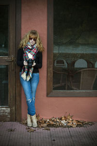 Woman with photo camera outdoors