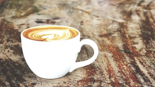 Close-up of cappuccino on table