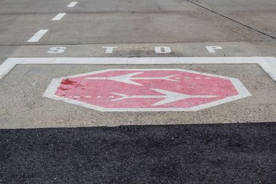 High angle view of stop sign at airport