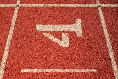 High angle view of arrow sign on wall