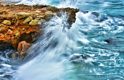 Scenic view of splashing waves