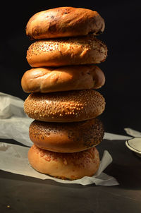 Stack of bagels on table