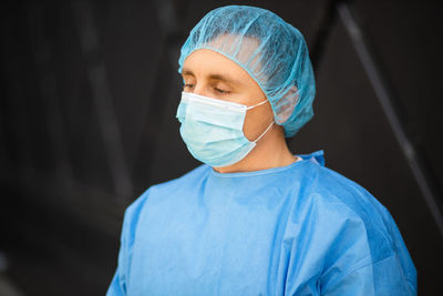 Doctor wearing mask looking away