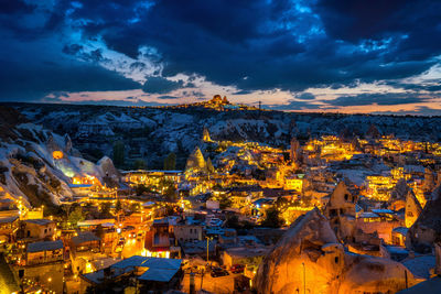 Aerial view of illuminated buildings in city