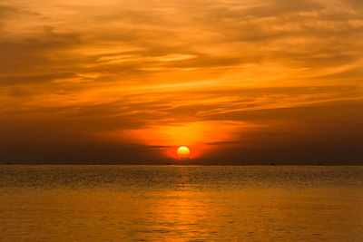 Scenic view of sea against romantic sky at sunset