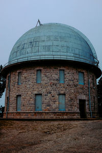 Low angle view of old building against clear sky