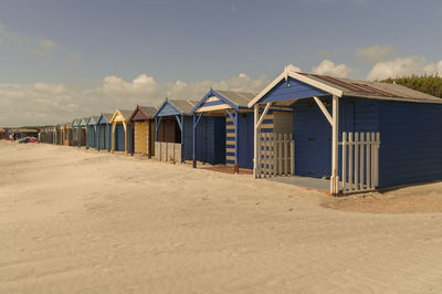 Beach huts against sky