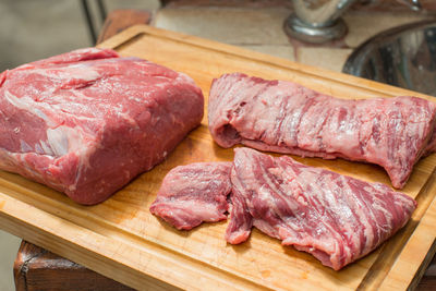 High angle view of meat on cutting board