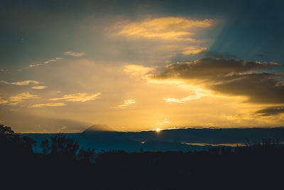 Scenic view of silhouette landscape against sky during sunset