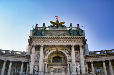 Low angle view of statue against sky