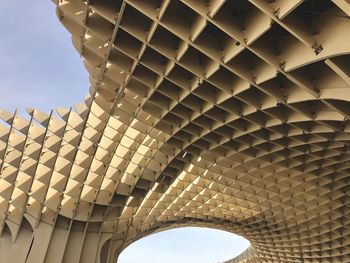 Low angle view of modern ceiling against clear sky