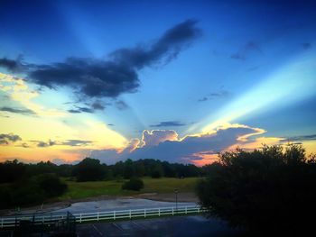 Scenic view of landscape against cloudy sky