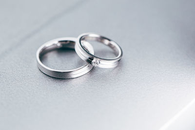 High angle view of platinum wedding rings on table