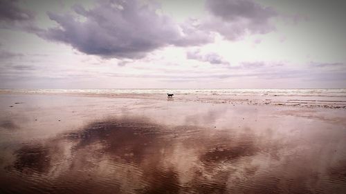 Scenic view of sea against dramatic sky