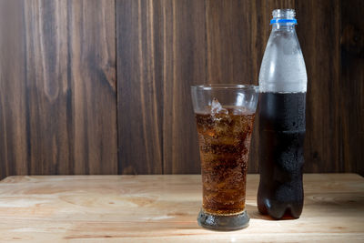 Close-up of glass bottle on table