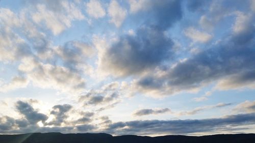 Low angle view of cloudy sky during sunset