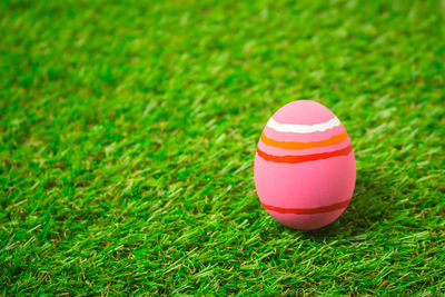 Close-up of multi colored ball on field